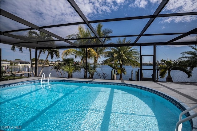 outdoor pool with a patio and a lanai