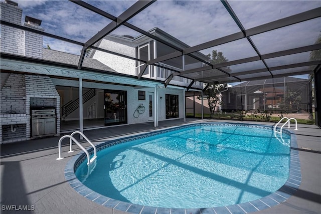 pool with a lanai and a patio