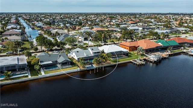 aerial view featuring a water view and a residential view