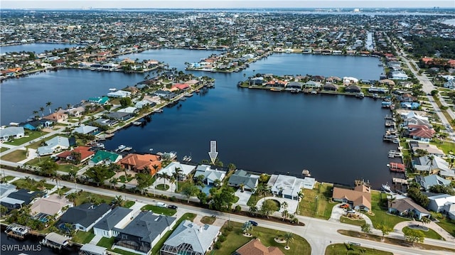 aerial view with a residential view and a water view