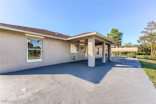 exterior space with a carport