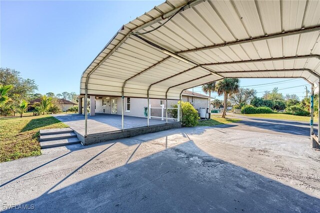 view of car parking featuring a carport