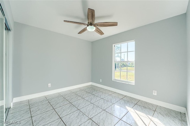 spare room featuring ceiling fan