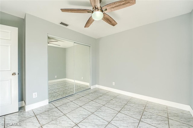 unfurnished bedroom with a closet and ceiling fan