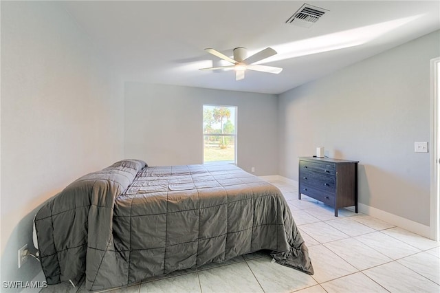 bedroom with ceiling fan and light tile patterned floors