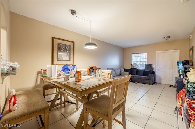 dining area with light tile patterned flooring