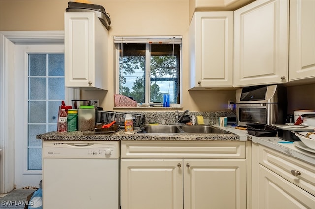 kitchen with sink, white cabinets, and dishwasher