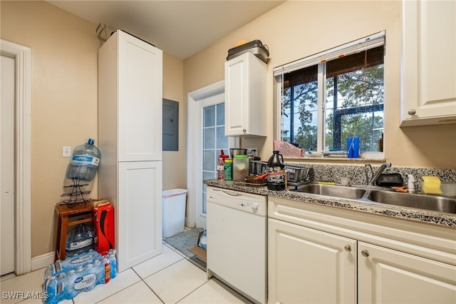 kitchen with light tile patterned floors, sink, white dishwasher, and white cabinetry