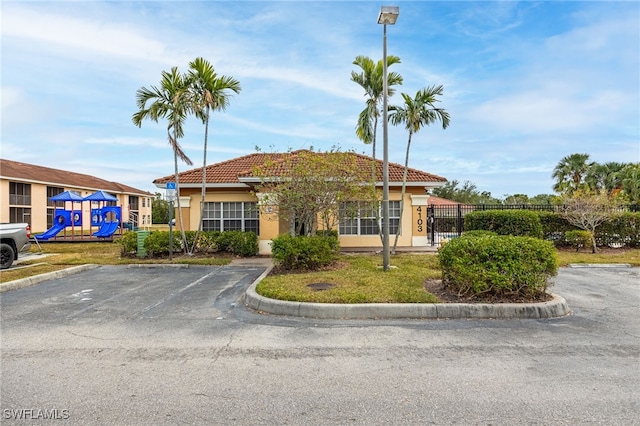 view of front of house with a playground