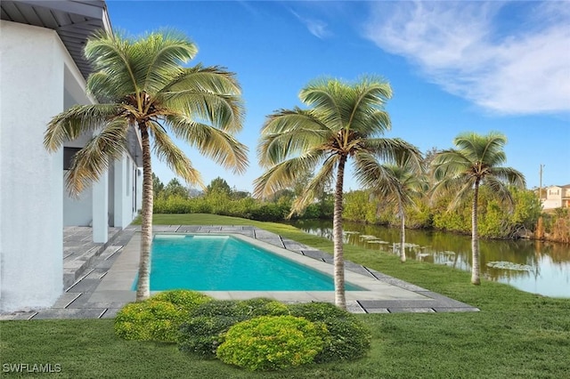 view of pool featuring a water view and a yard