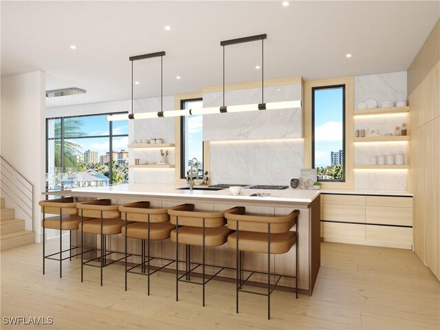 kitchen with modern cabinets, open shelves, a kitchen breakfast bar, and light countertops