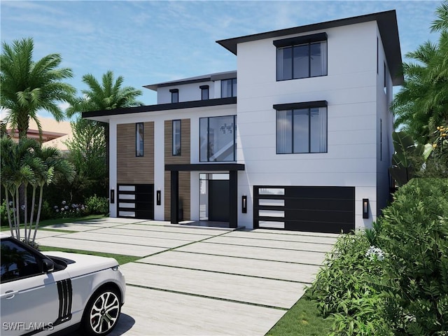 contemporary home with concrete driveway and an attached garage