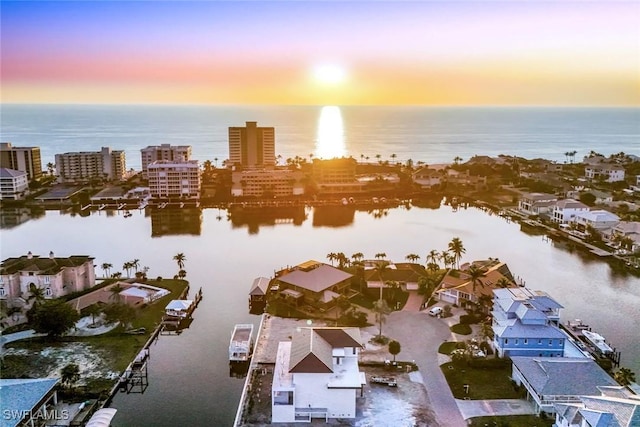 aerial view at dusk with a water view