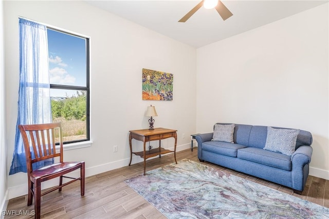 sitting room featuring ceiling fan and light hardwood / wood-style flooring