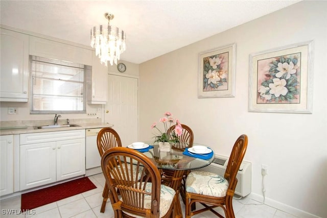 dining area with light tile patterned floors, an inviting chandelier, and sink