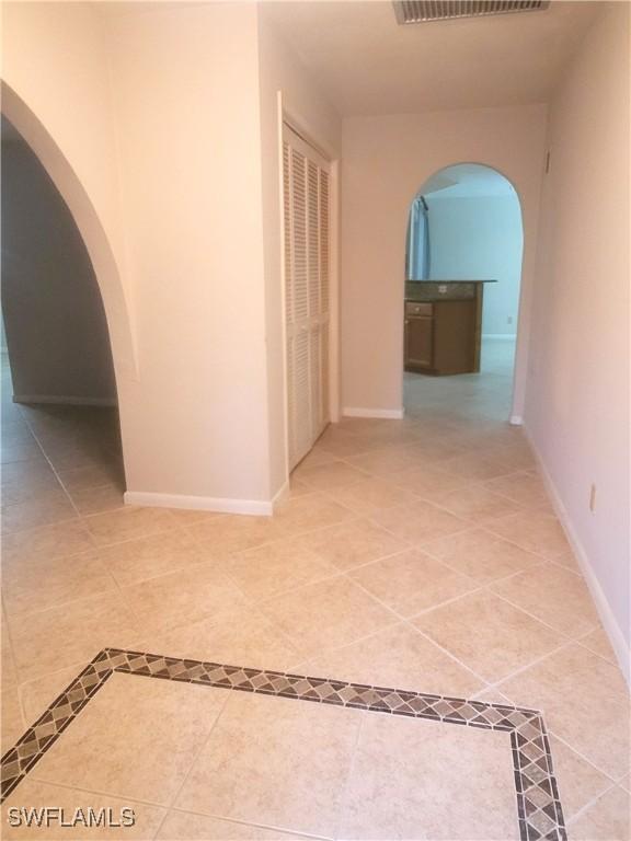 corridor with tile patterned floors