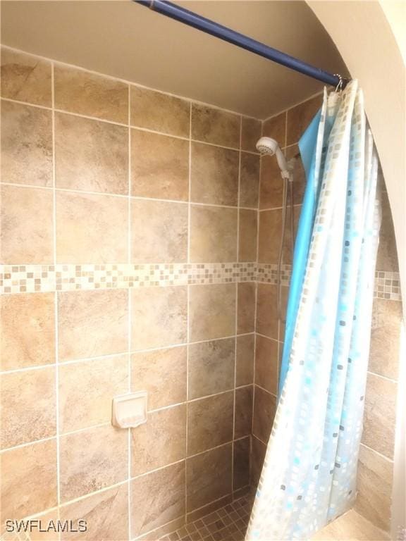 bathroom with a shower with curtain