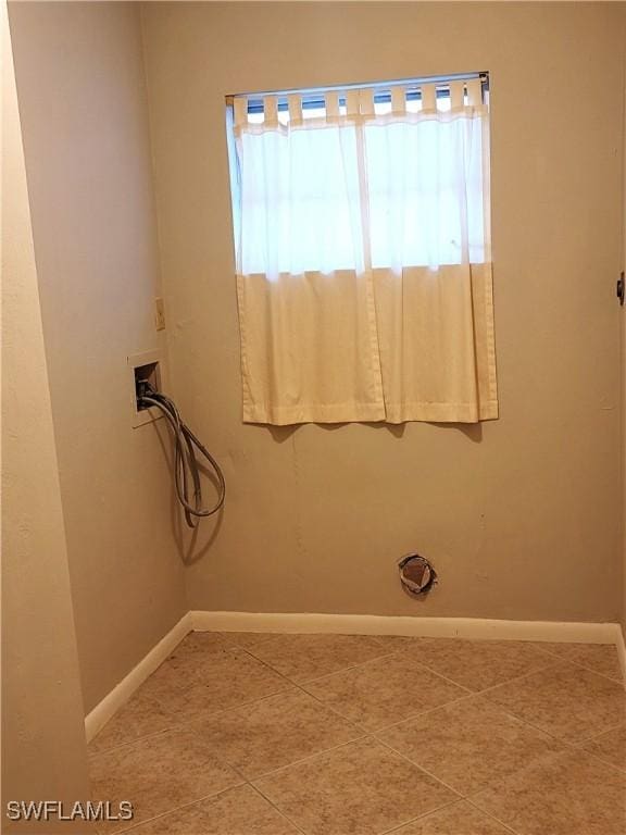 bathroom with tile patterned floors