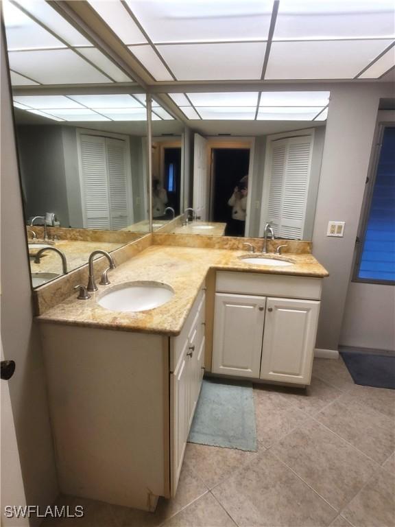 bathroom with tile patterned flooring and vanity