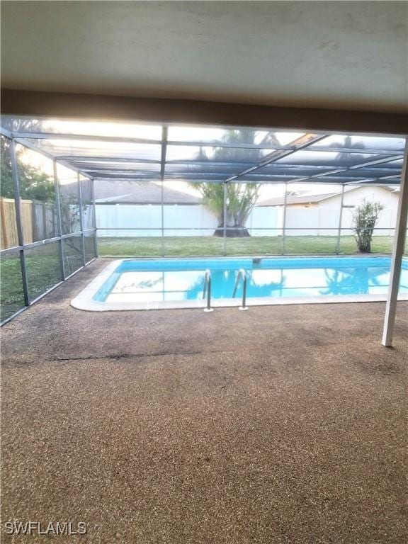 view of pool with a lanai