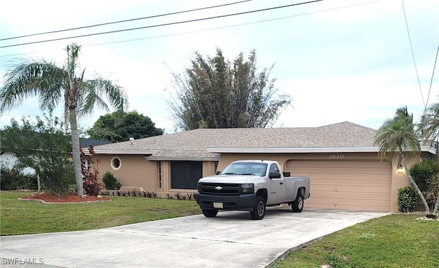 ranch-style home featuring a front yard and a garage