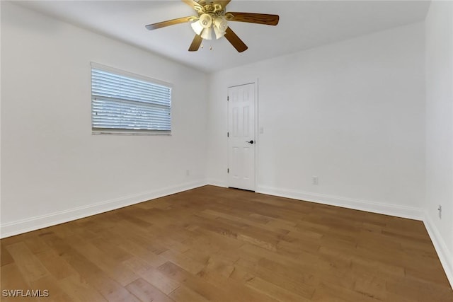 unfurnished room featuring hardwood / wood-style flooring and ceiling fan