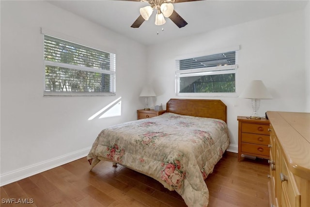 bedroom with wood-type flooring and ceiling fan