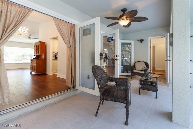 sitting room featuring ceiling fan