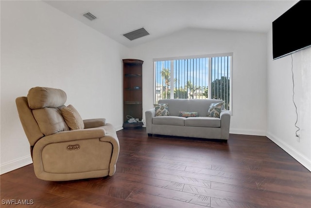 sitting room featuring dark hardwood / wood-style floors and lofted ceiling