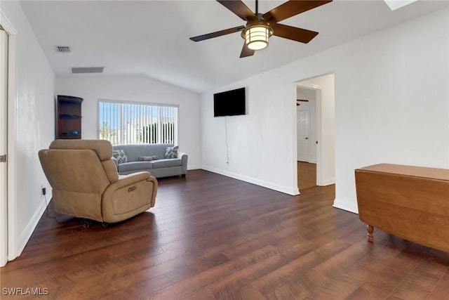 living room featuring vaulted ceiling, ceiling fan, and dark wood-type flooring