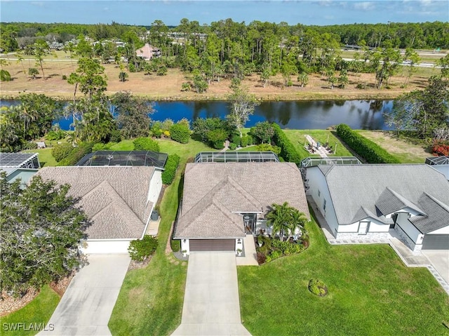 birds eye view of property with a water view