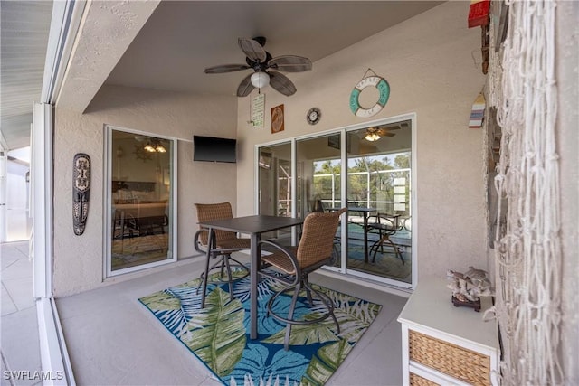 view of patio featuring ceiling fan