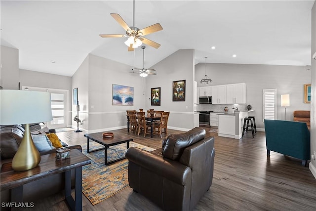 living room featuring ceiling fan, dark hardwood / wood-style floors, and high vaulted ceiling