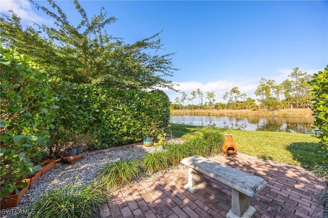 view of patio with a water view