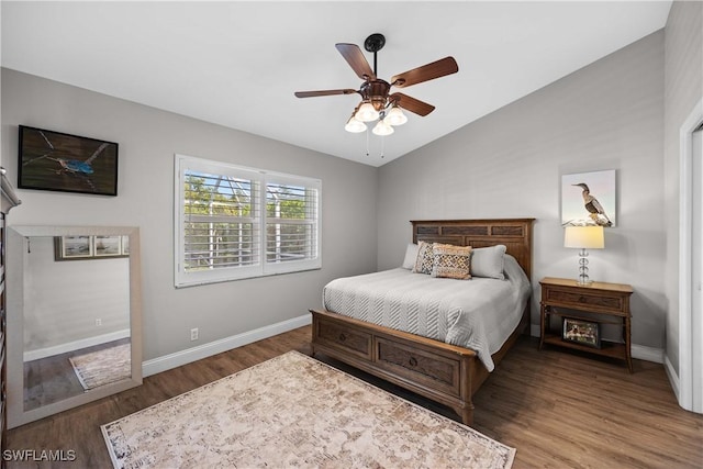 bedroom featuring vaulted ceiling, ceiling fan, and dark hardwood / wood-style floors