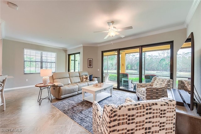 tiled living room featuring ceiling fan, plenty of natural light, and crown molding