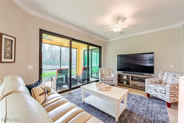 living room featuring tile patterned flooring, ceiling fan, and ornamental molding