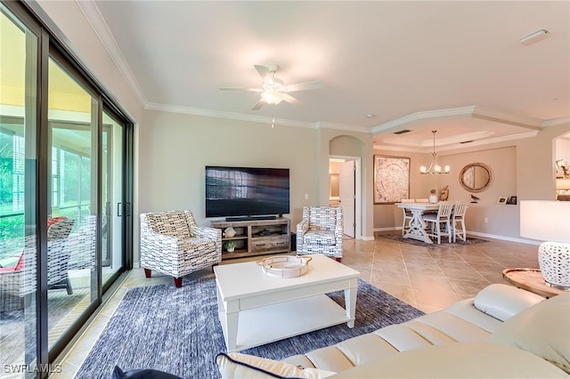 tiled living room with ceiling fan with notable chandelier and crown molding