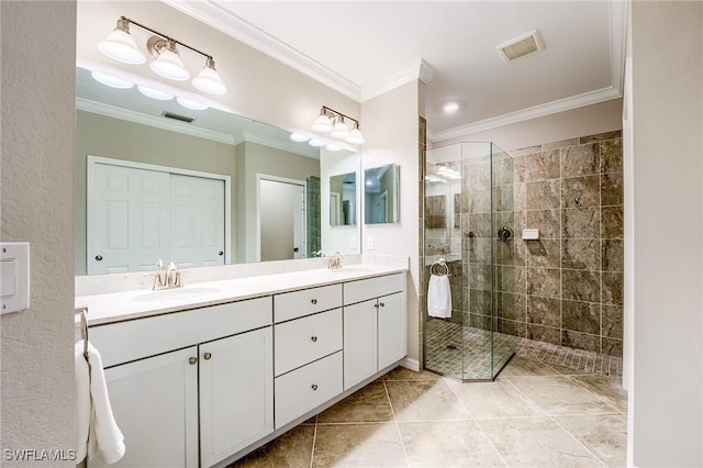 bathroom with tile patterned flooring, a tile shower, vanity, and ornamental molding