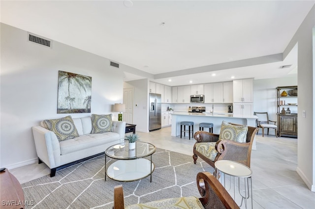 living room with light tile patterned flooring