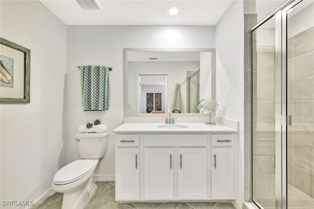 bathroom with vanity, toilet, and walk in shower