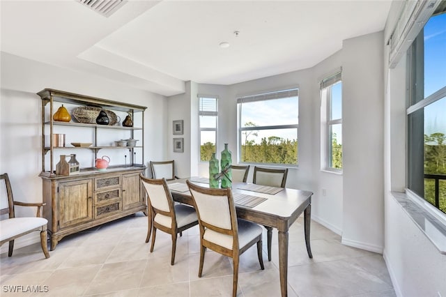 dining area featuring light tile patterned floors