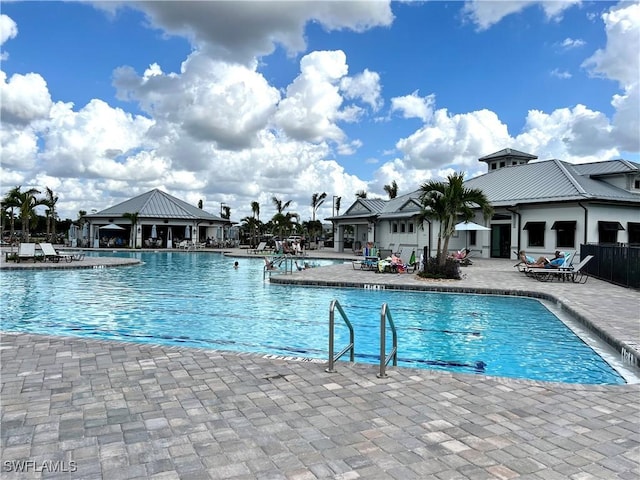 view of swimming pool with a patio area