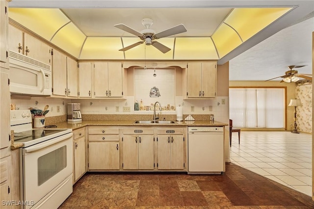 kitchen with ceiling fan, cream cabinets, sink, and white appliances