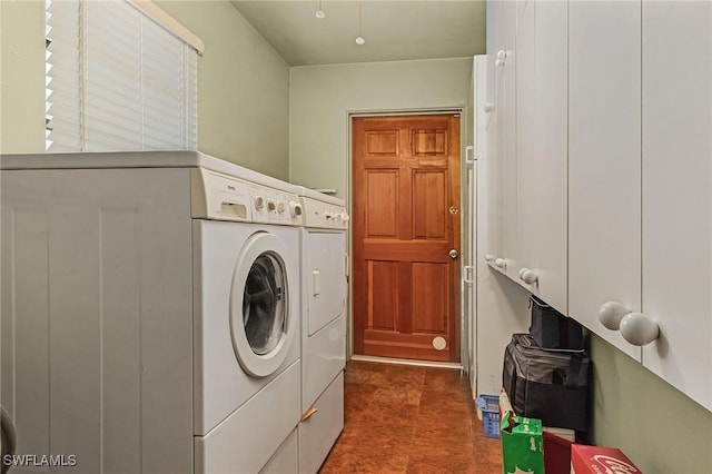 clothes washing area with washing machine and clothes dryer