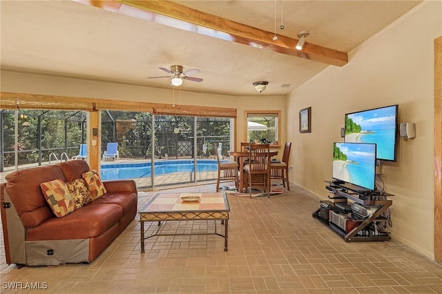 living room featuring ceiling fan and beamed ceiling