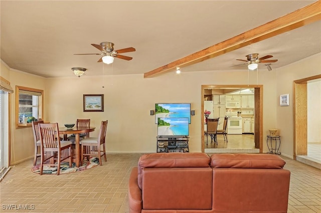 living room with beamed ceiling and ceiling fan