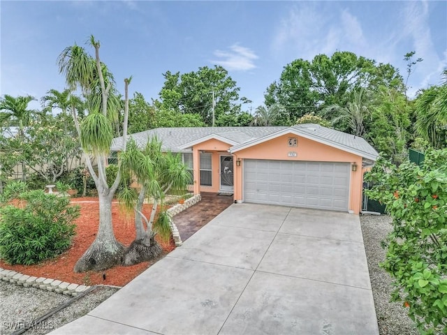 single story home featuring a garage