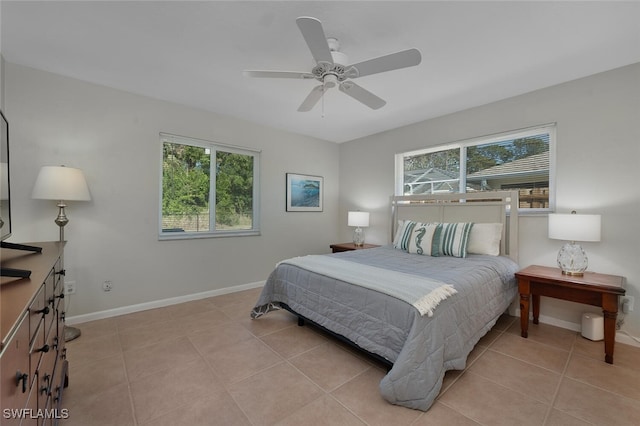 bedroom featuring ceiling fan and light tile patterned floors