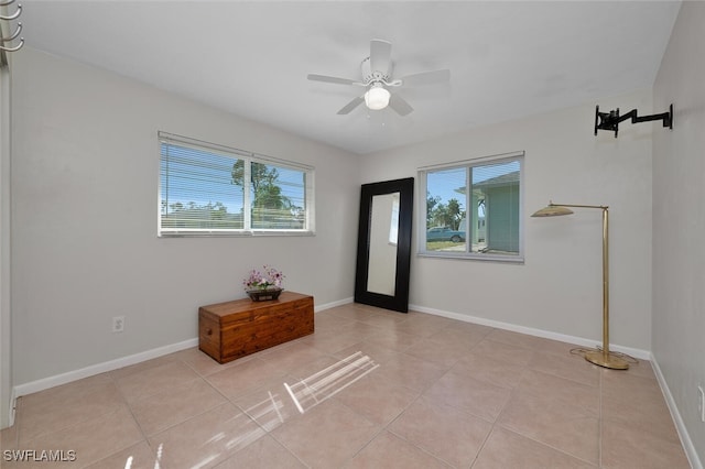 entrance foyer featuring ceiling fan and light tile patterned floors